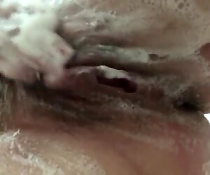 Wife washing her tits and hairy pussy