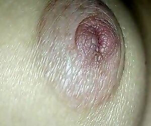 Peaking at wife Cathy in bed