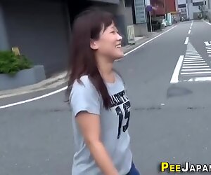 Asian leaves piss stream outdoors