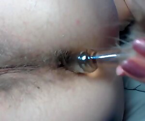 Tail plugged deep into hairy asshole