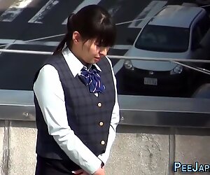 Asian lady pisses herself