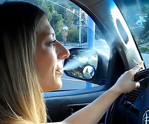 expert mature smokes in car.