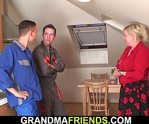 Busty old grandma spreads legs for two repairmen