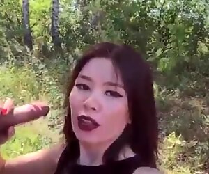 Asian girl loves from behind in the forest