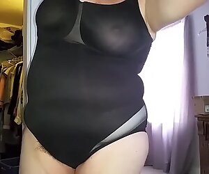 putting on her black girdle,hair sticking out, nipples