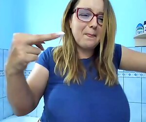 Busty blonde flashes her boobs